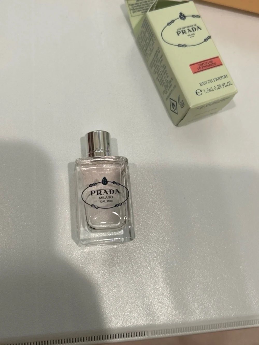 Prada pale mint green box with coral-pink label